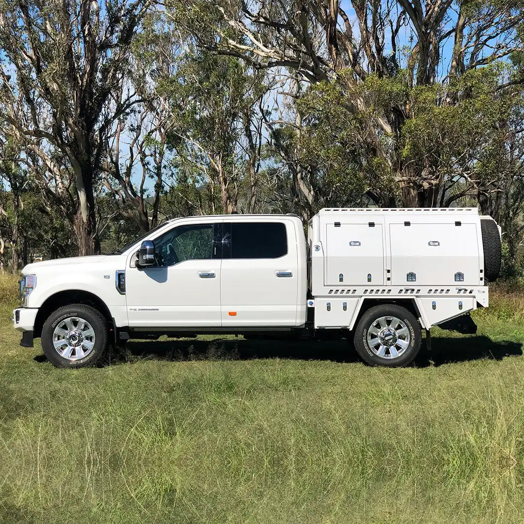 White Ford F-250 with a DMW tray and full length touring canopy
