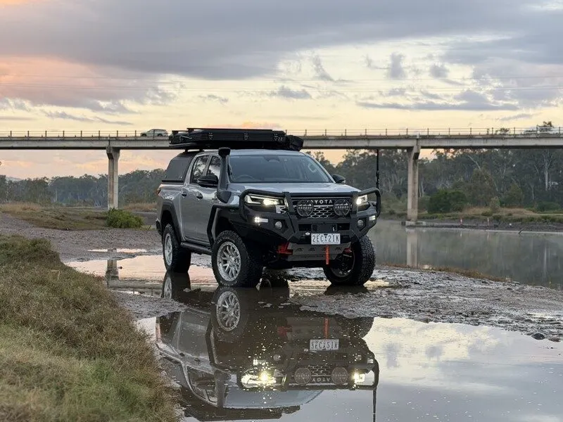 Toyota HiLux N90 fitted with an Opposite Lock bull bar beside a river crossing