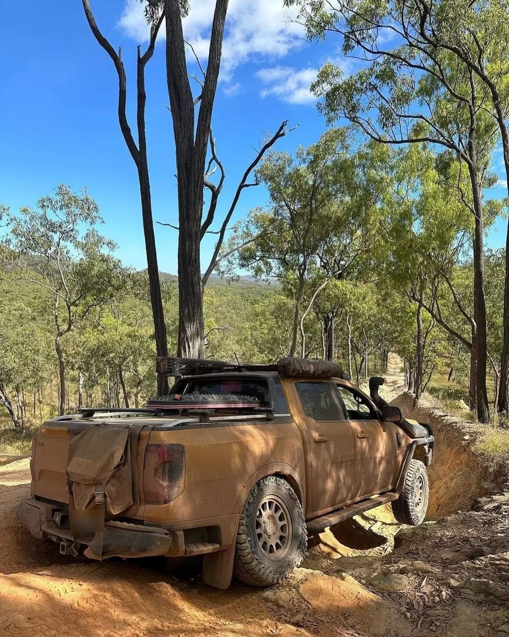 Ford Ranger Next Gen on Method MR703 wheels in titanium on a dirt track