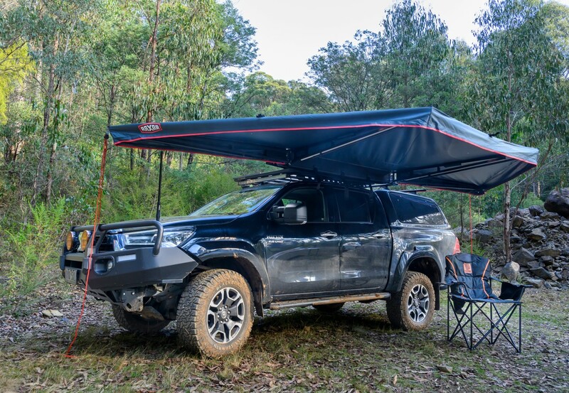 HiLux with a Raxar 180 awning and camp chairs at a bush campsite